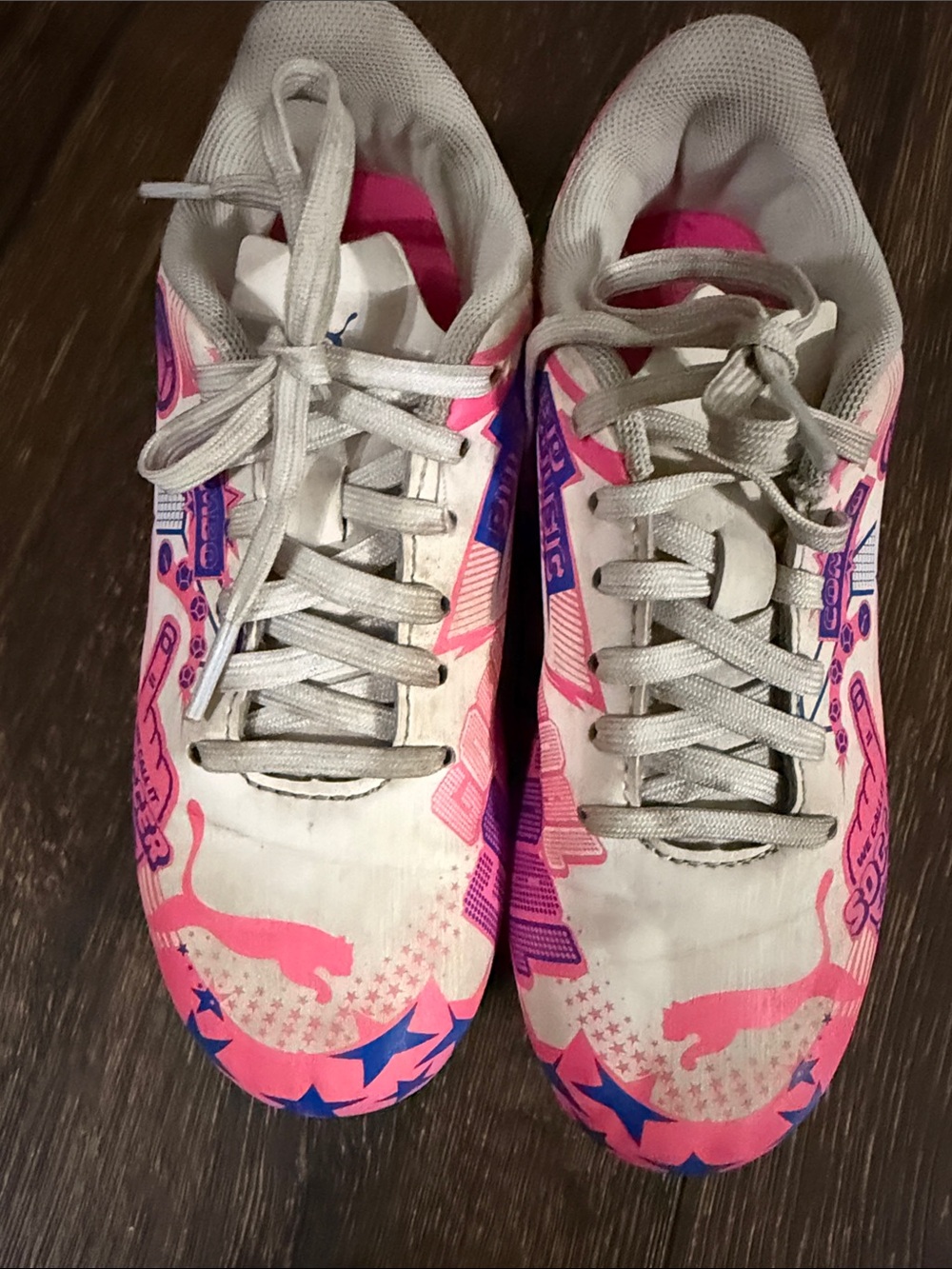 Puma girl’s White soccer cleats with Pink & Blue Accents